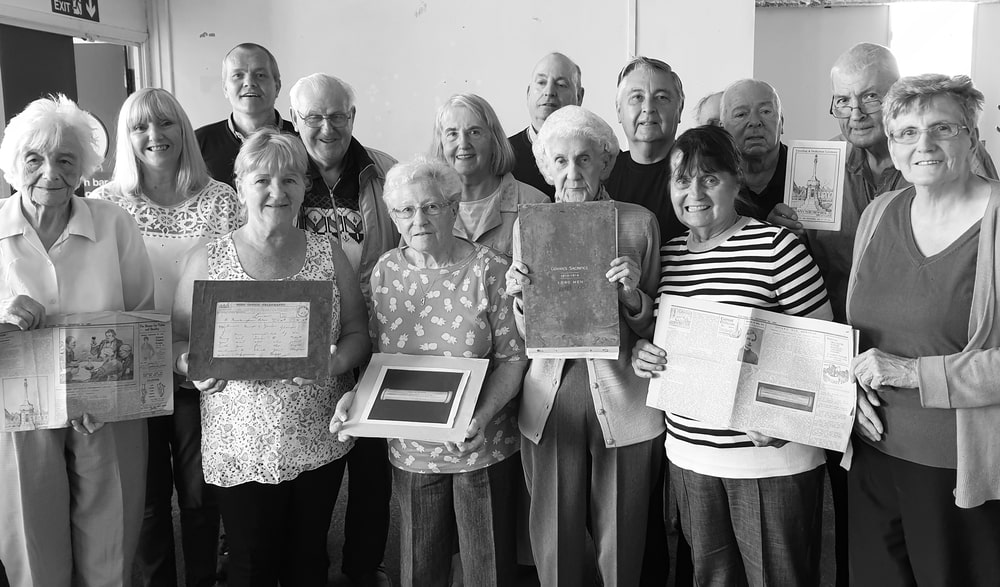 Govan Reminiscence Group members with Roll of Honour