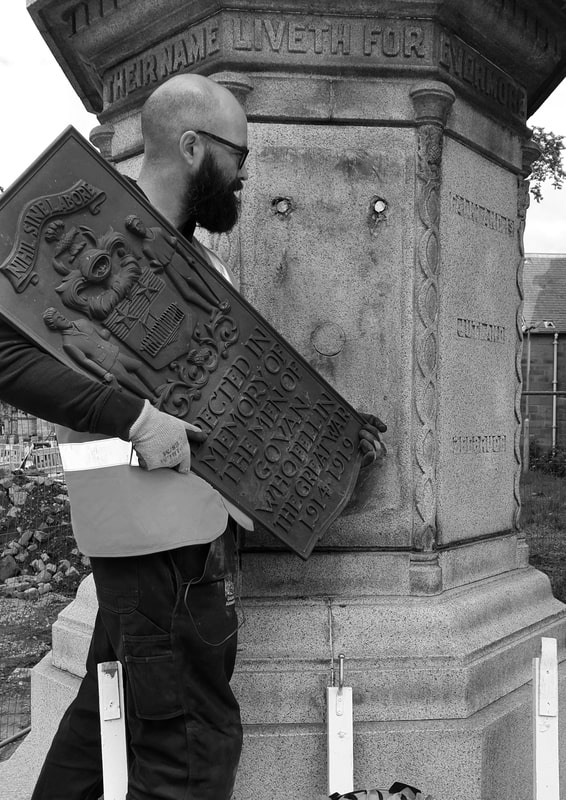 Jonathan from Graciela Ainsworth Conservation removes Bronze Plaque
