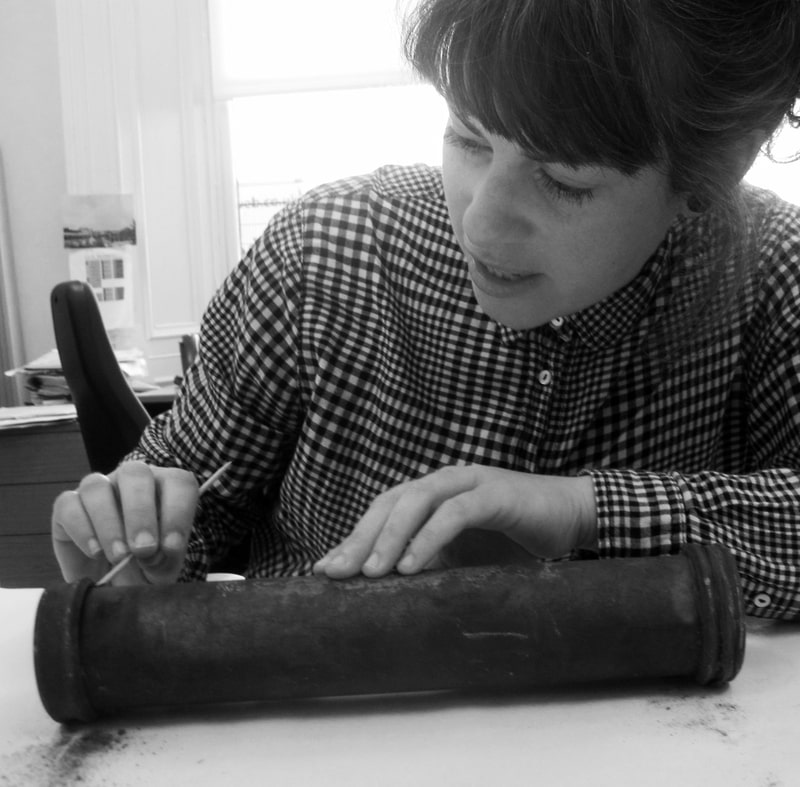 Conservator from Graciela Ainsworth works on silver-plated casket